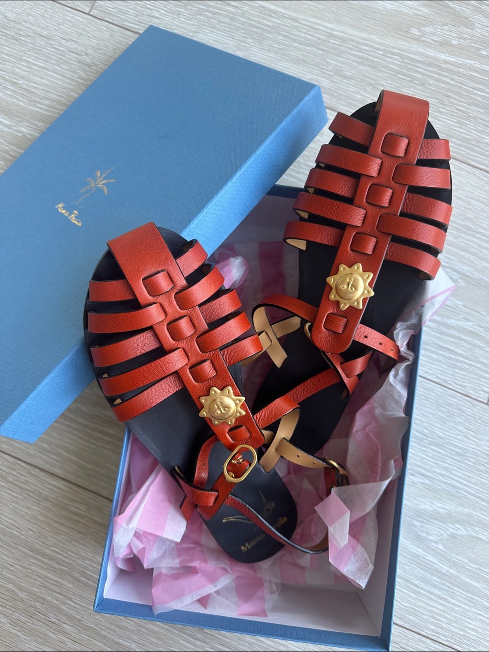Orange Leather Strappy Sandals with Gold Sun Medallion Accent